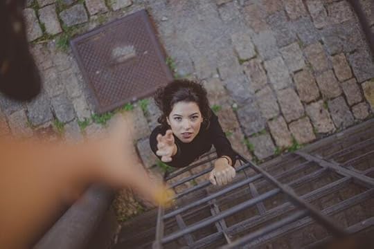 women getting help up a ladder, weakness