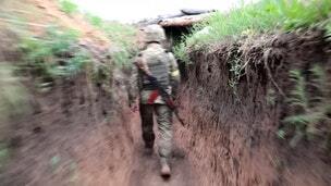 Ukrainian troops patrol Donetsk frontline trenches
