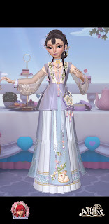 Lai in a lavender and sky-blue ensemble decorated with flowers and bunny rabbits