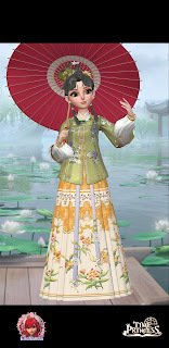 Lai in a green floral top and long skirt decorated with yellow flowers