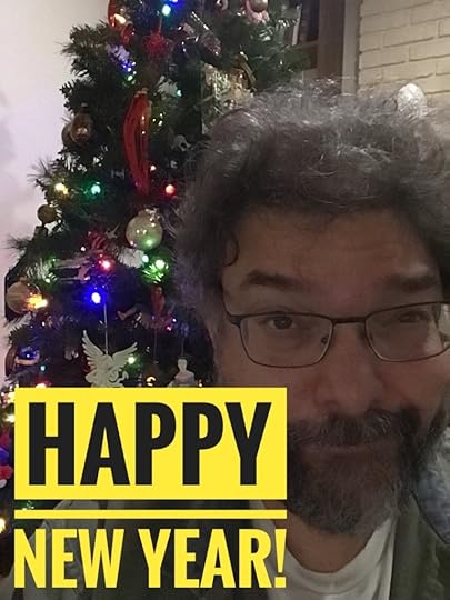 Image of Jason in front of a Christmas tree with Spider-Man, an angel, and a Japanese lady prominent. He’s smiling. Big yellow letters wish the viewer Happy New Year.