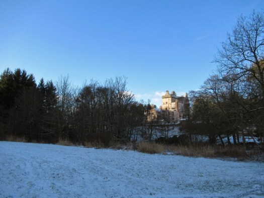 Delgatie Castle on the horizon. Ailish Sinclair | Castles in the Snow
