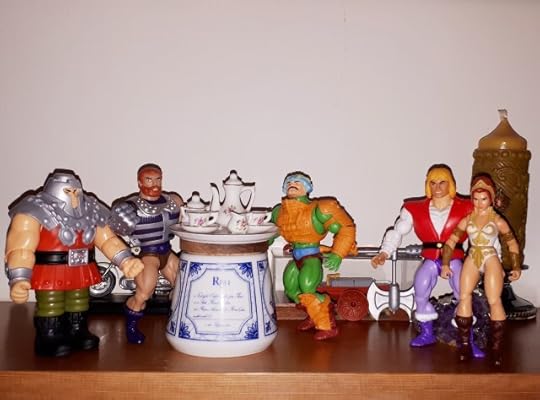 Man-at-Arms throws a sceptical look at Adam and Teela