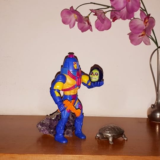 Man-e-Face holds Skeletor's skull, performing Hamlet