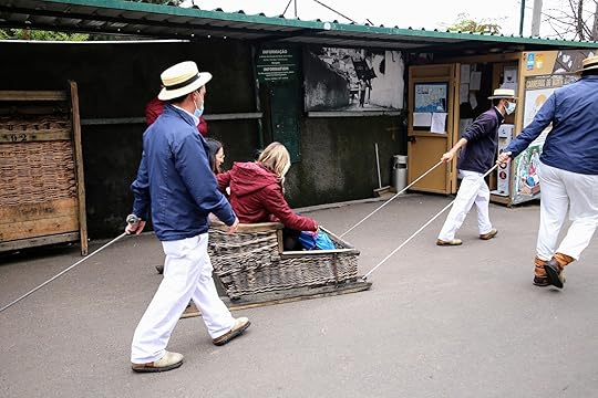 Madeira toboggans are driven by men in rubber shoes