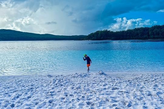 Younge boy on beach in Australia backpacking with kids