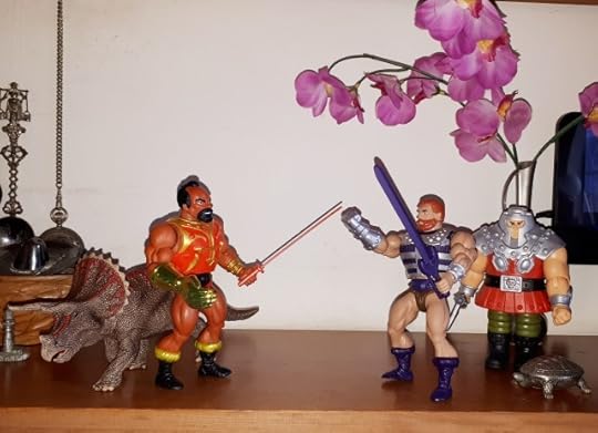 Jitsu versus Fisto, while Ram-Man and a triceratops look on.