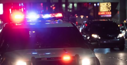 Police cars with sirens on