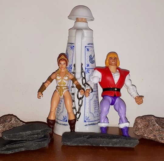 Adam and Teela in chains.