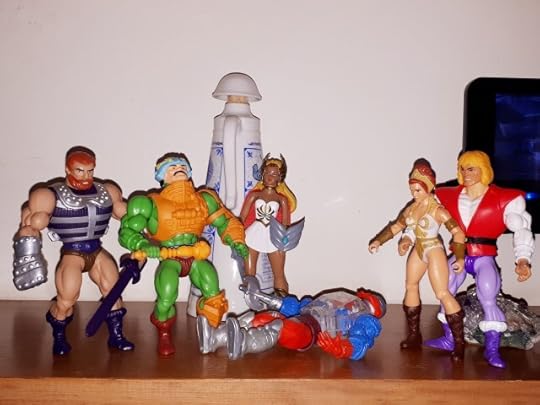 Fisto, Duncan, She-Ra, Teela and Adam stand around the fallen Roboto.