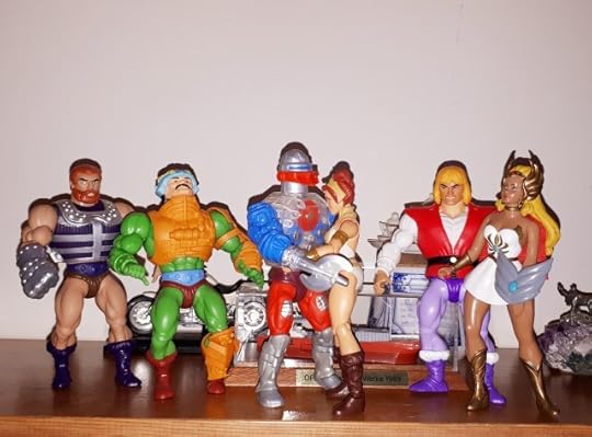 Teela hugs Roboto, while Fisto, Duncan, Adam and She-Ra look on.