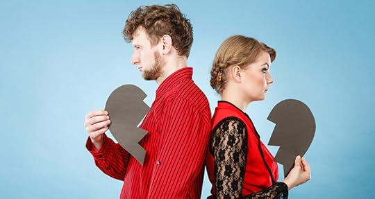Photo in shades of green showing a man and woman standing with their backs to each other, each holding a paper cutout of half of a broken heart. Dyslexia can take its toll on relationships when it is not fully understood.