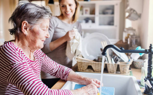 grandmother and young woman in the kitchen