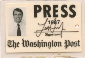 Press credential with Downie's photo at left, signature in middle, 