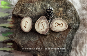 Reindeer antler runes Dagaz, Sowilo, and Eihwaz on a flat stone with a small silver pinecone, and the words 