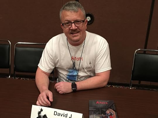 David J. Pedersen at a table