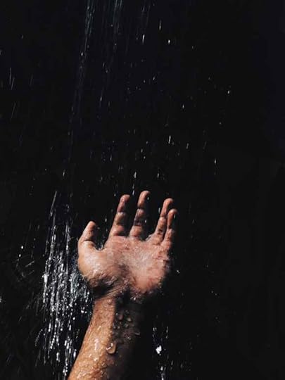 person s left hand catching water