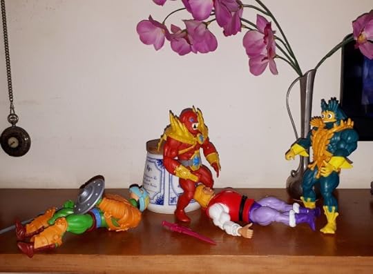 Beast-Man and Mer-Man carry off the unconscious Prince Adam.