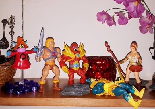 Mer-Man is down and Teela faces off against Beast-Man, while He-Man and Orko sneak up from behind.