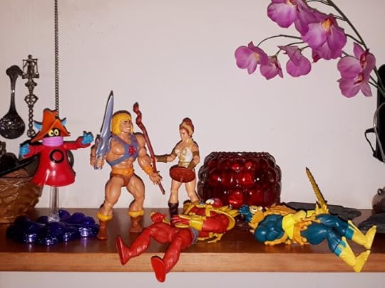 Beast-Man and Mer-Man are down and Teela rushes towards He-Man and Orko.