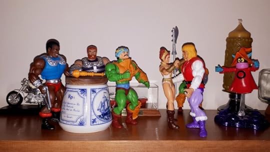 Teela hugs Adam, while Duncan, Clamp-Champ, Fisto and Orko look on.