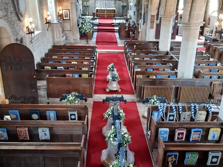 aerial view of bells in church aisle