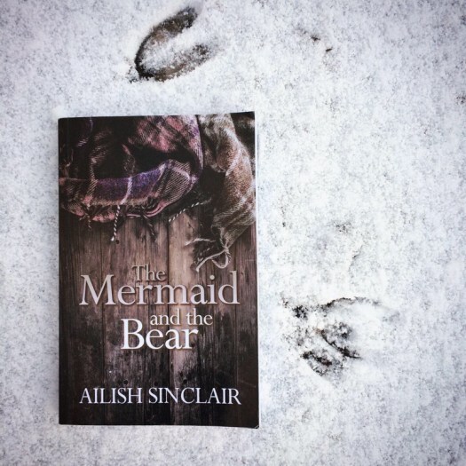 The Mermaid and the Bear by Ailish Sinclair in the snow by deer tracks