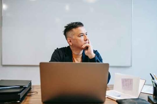 photo of man in deep thoughts