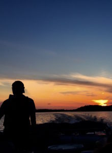 Husband driving boat 7-4-16