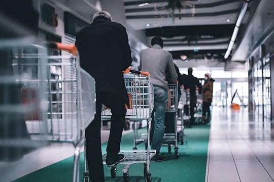 Image: a long line of people with shopping carts