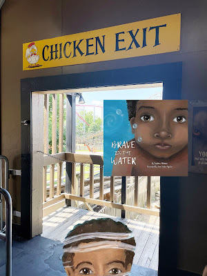 A cartoon of the top half of a head of a dark-skinned boy with black hair peeks into a photograph of a non-cartoon doorway with a rollercoaster in the background. Above the doorway is a sign that says
