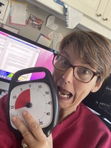 Liane showing her TimeTimer device