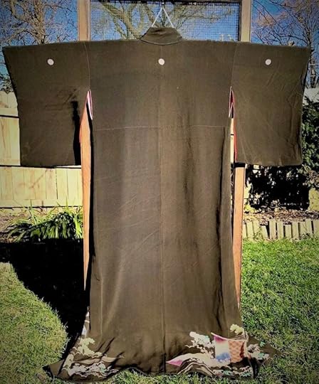Black kimono hanging on a stand