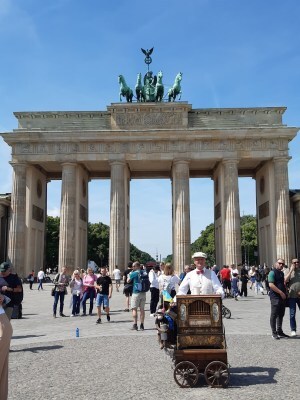 photo of the Brandenburg Gate with organ grinder