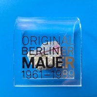 photo of souvenir piece of Berlin Wall with plastic mount