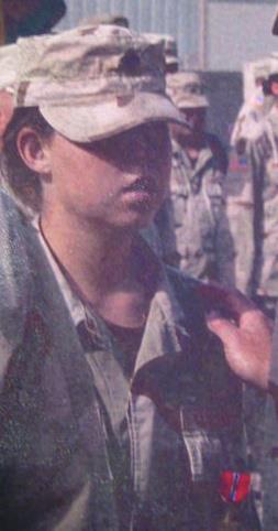 Ashley (Pullen) Hawkins being awarded the Bronze Star with