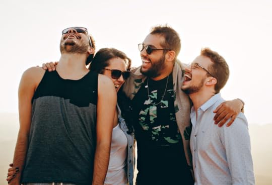 group of friends laughing, optimism