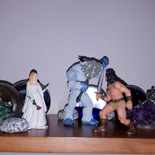 Conan fights Ymir, while Atali looks on.