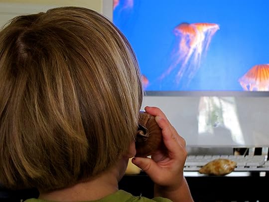 Child watching Jelly fish cam while learning about ocean math