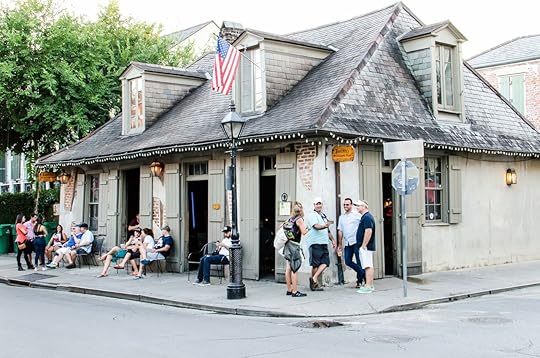 People sitting by Lafitte's blacksmith shop bar in New Orleans, Bourbon Street bars