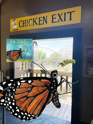 A cartoon monarch butterfly and caterpillar float before an open door with a real-life roller coaster behind it. Above the door is a yellow sign that says