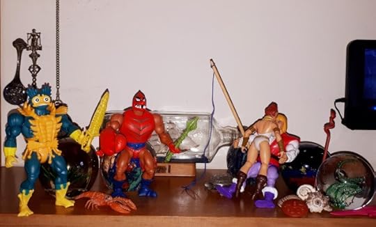 Clawful and Mer-Man sneak up on Adam and Teela making out.