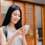 traveler girl smile check smartphone