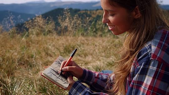 hiking for beginners - woman sketching in notebook