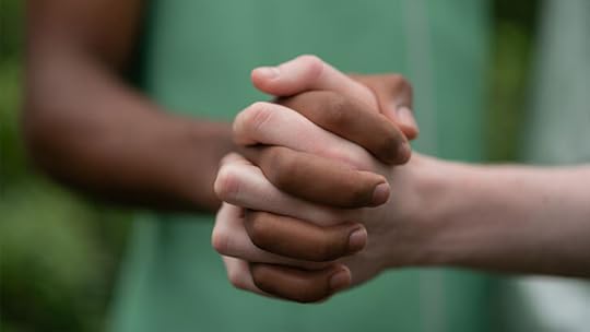 dark and light skin holding hands