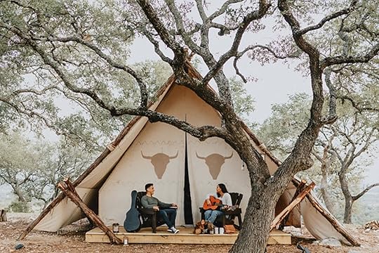People outside tent at Talula Mesa glamping Hill Country Texas