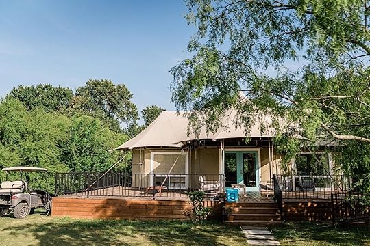 Tent with car outside at Wahwahtaysee Resort glamping Texas Hill Country