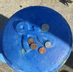 coins on a fire hydrant