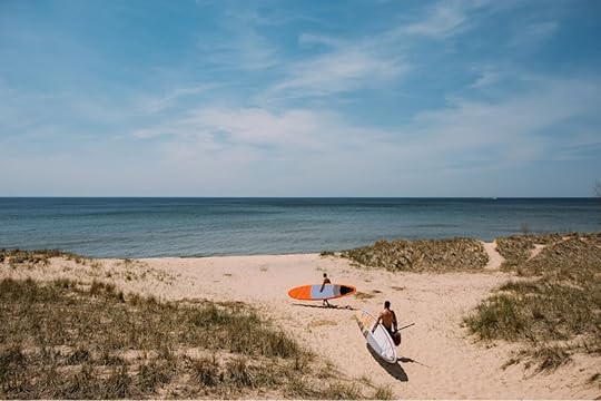 People kayaking in Michigan on Lake Mona 