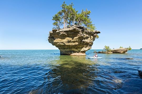 Person kayaking in Michigan at Port Austin